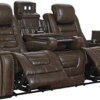 Signature Design by Ashley Game Zone Faux Leather Adjustable Power Reclining Sofa with Cup Holders and Storage, Brown