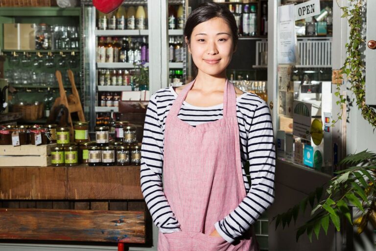 woman in shop wearing apron